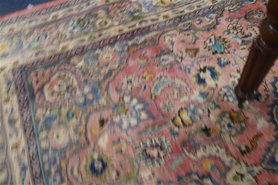 A Persian red ground carpet 371cm x 246cm